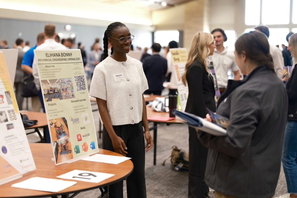 a student shows her work experience at the reverse career fair