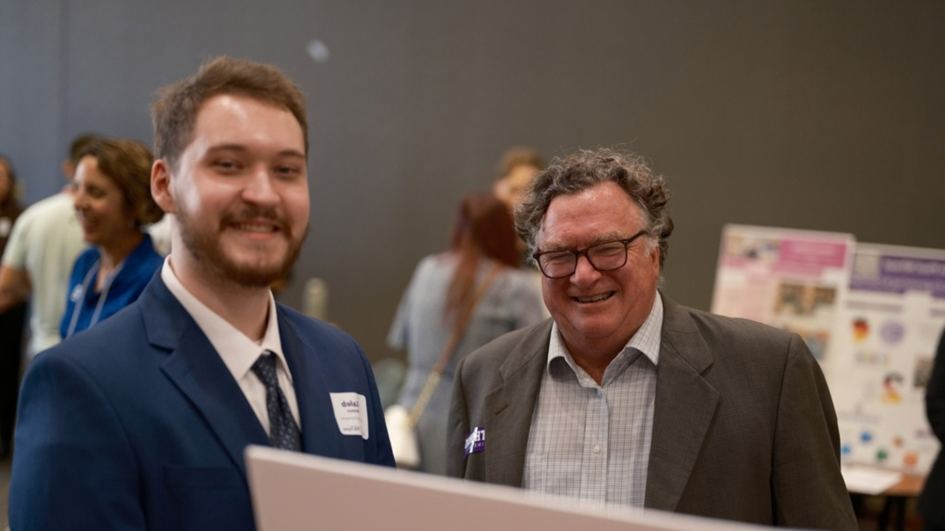 Don Weinkauf smiles with an engineering student at a reverse career fair