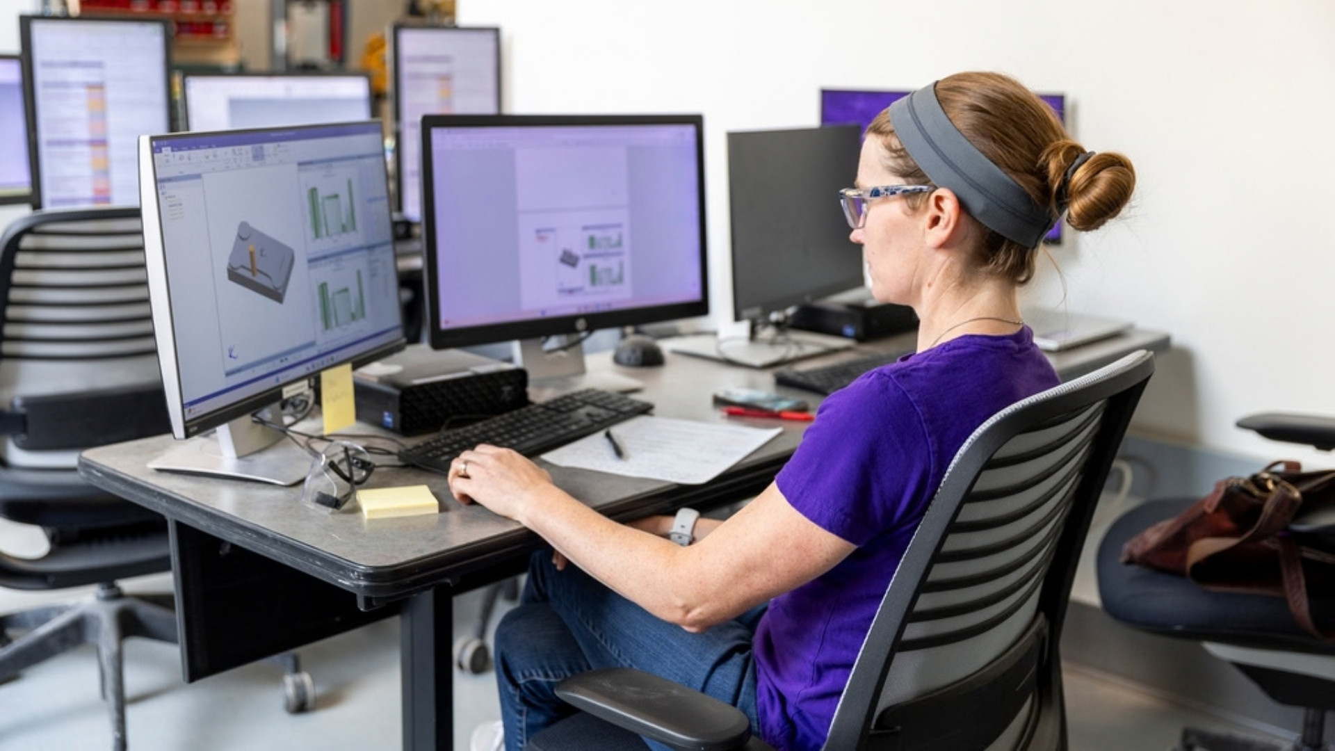 Dr. Tiffany Ling works on a computer in the advanced manufacturing center. 