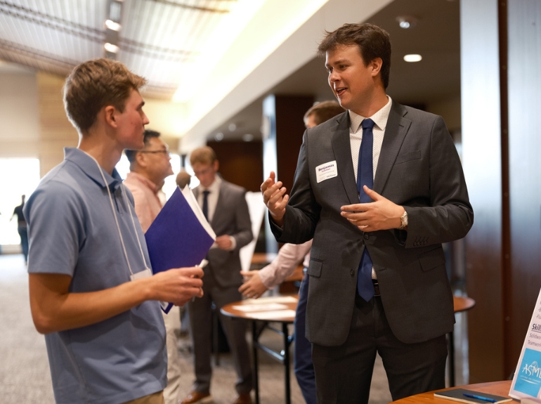 a student presents his work experience at the reverse career fair