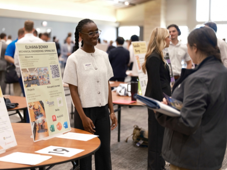 student at a reverse career fair