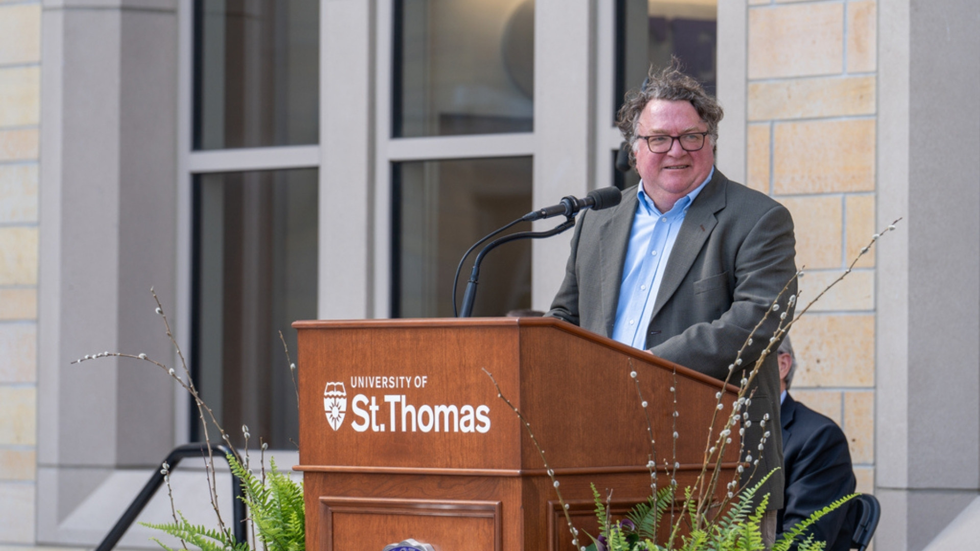 Dean Don Weinkauf speaking at the podium