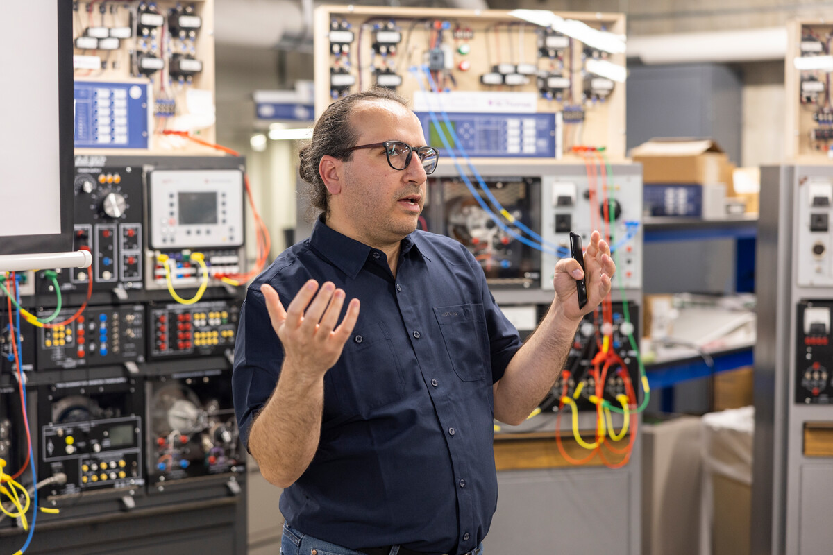 Dr. Mahmoud Kabalan lead a tour of the Center for Microgrid Research