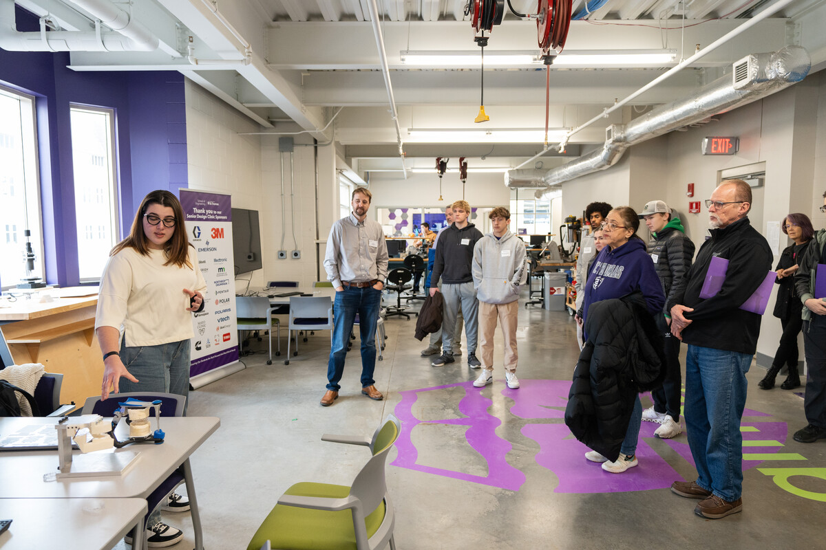 Engineering student presents a Senior Design Project during a tour of the Senior Design Clinic Studio at St. Thomas.