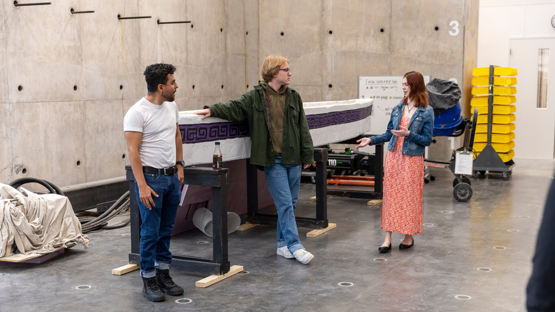 St. Thomas students present their concrete canoe at the Iversen Strong Wall