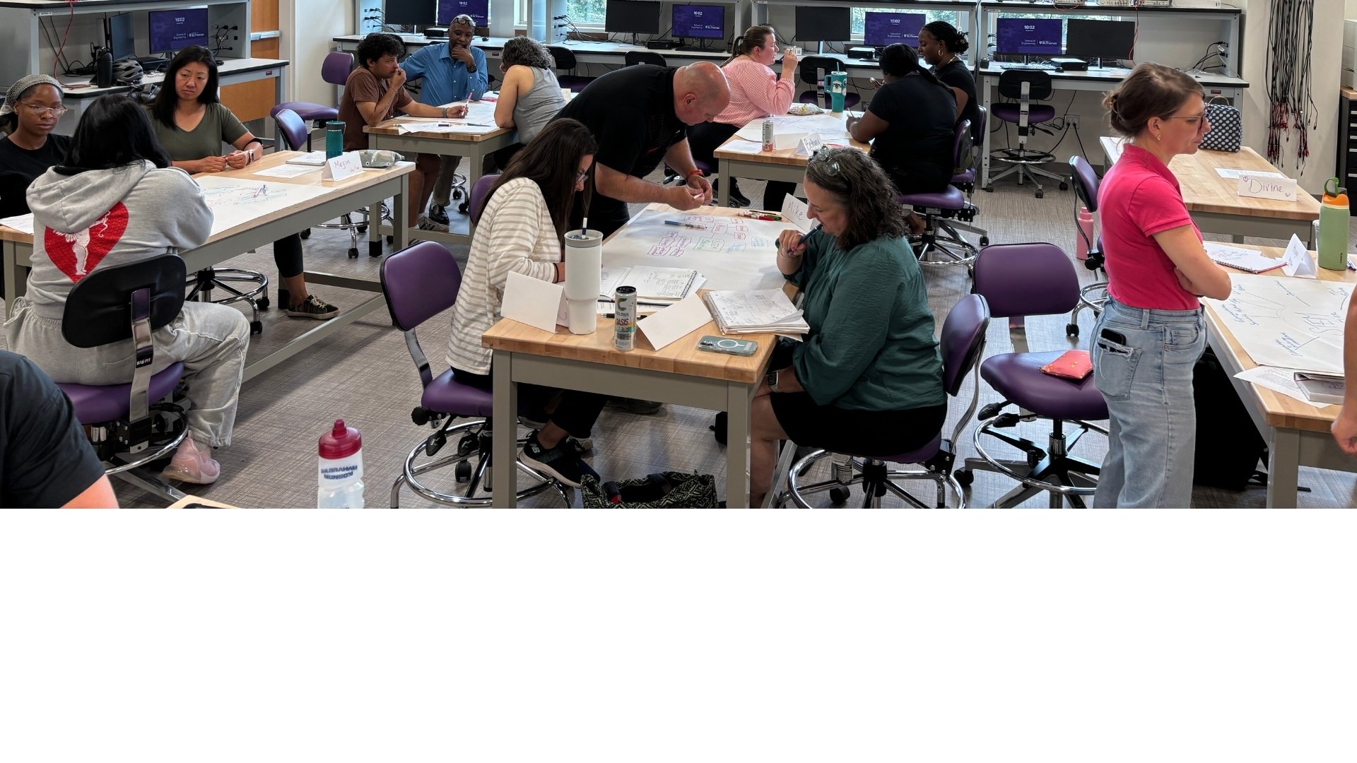 Engineering educator teaches in a classroom of young students