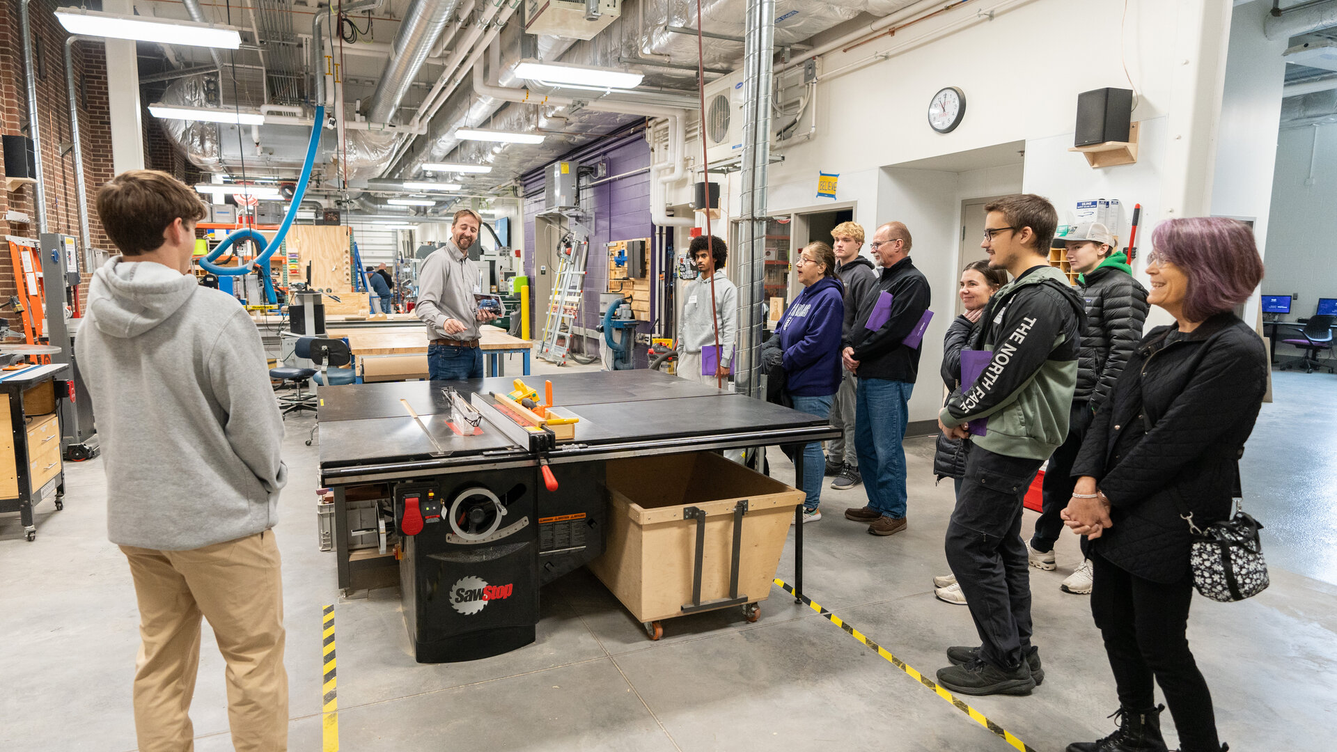 Students and parents take  a tour of engineering facilities at St. Thomas.