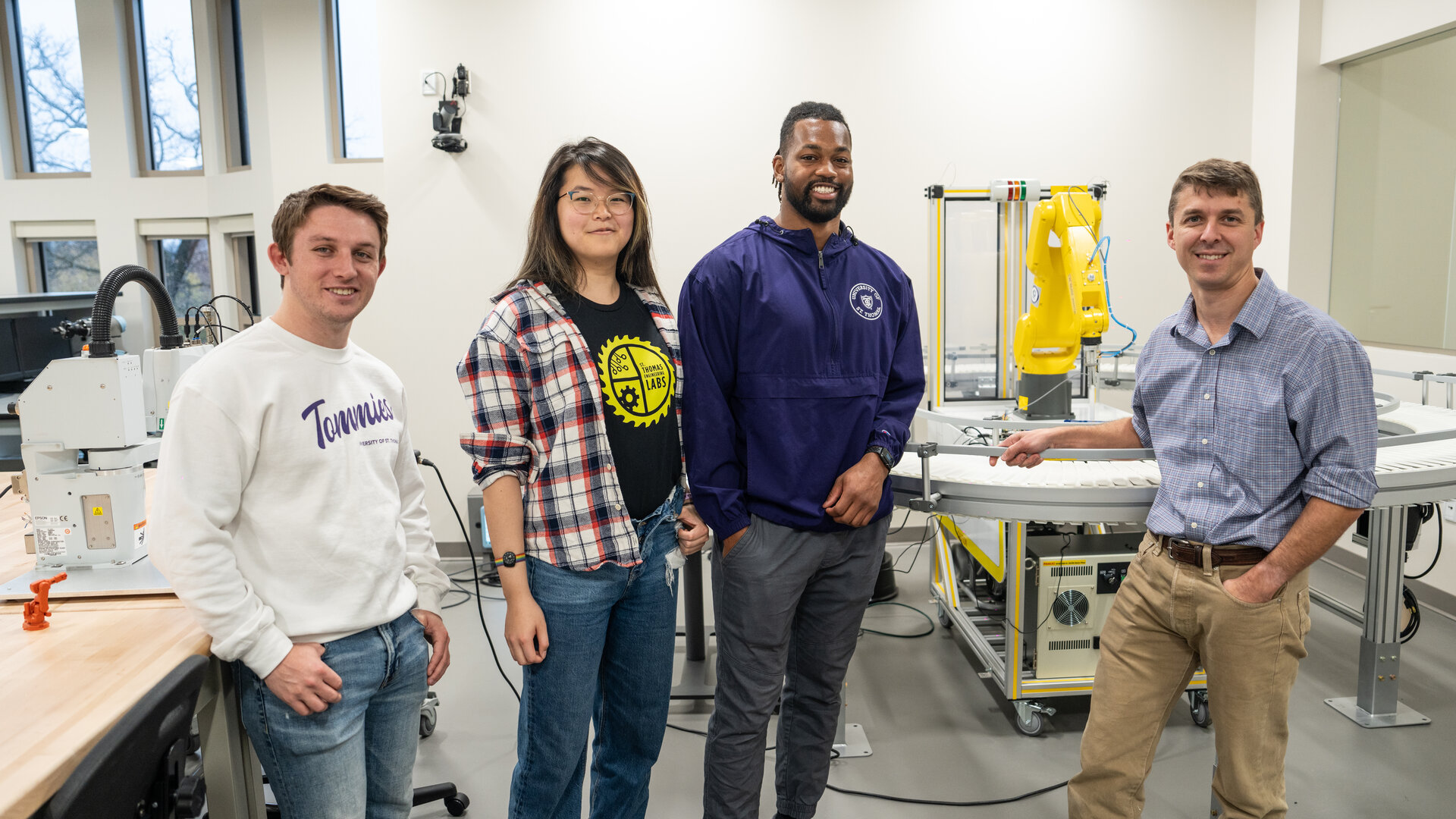 Mechanical engineering professor and students in robotics lab