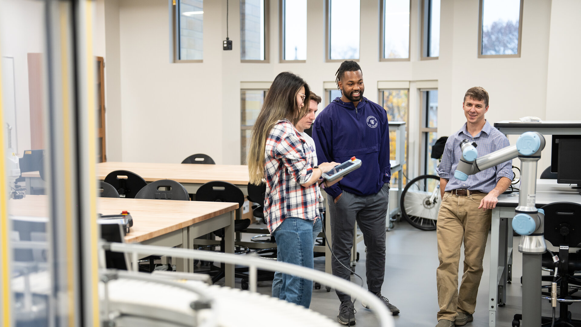 St. Thomas Engineering students and faculty in the Robotics and Automation Lab.