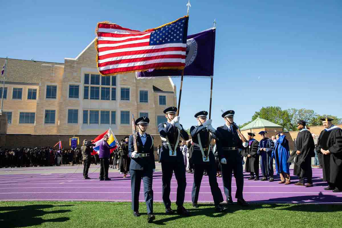 AFROTC Color Guard walks during commencement ceremony.