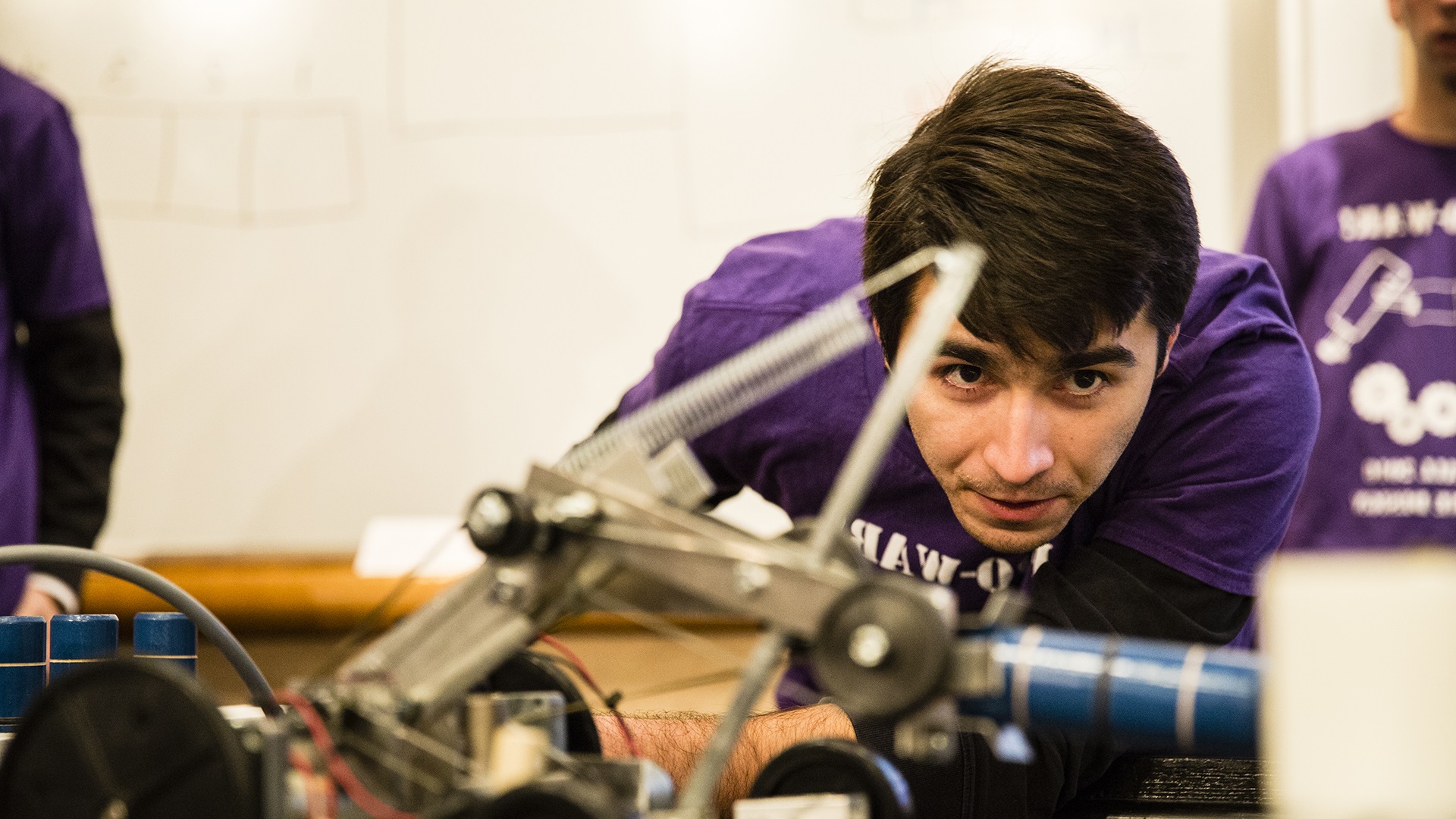 Engineering student concentrates during a machine design competition.