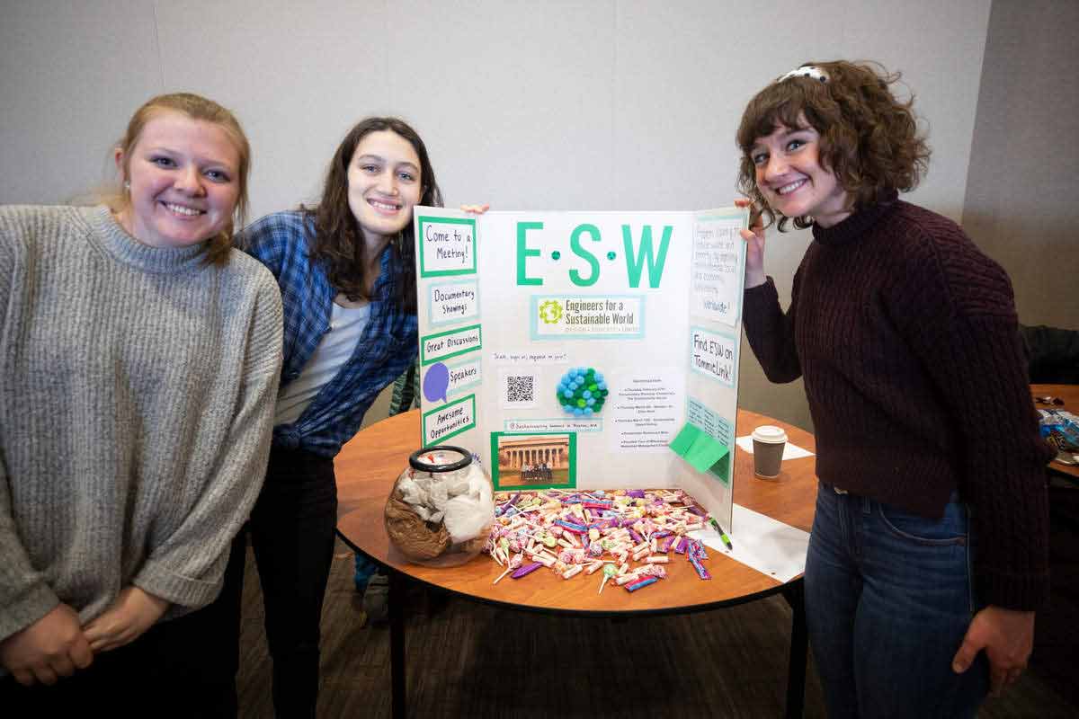 Members of the Engineers for a Sustainable World show off their display