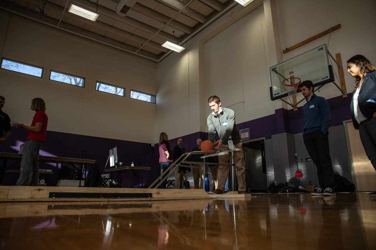 Students participate in concrete bowling