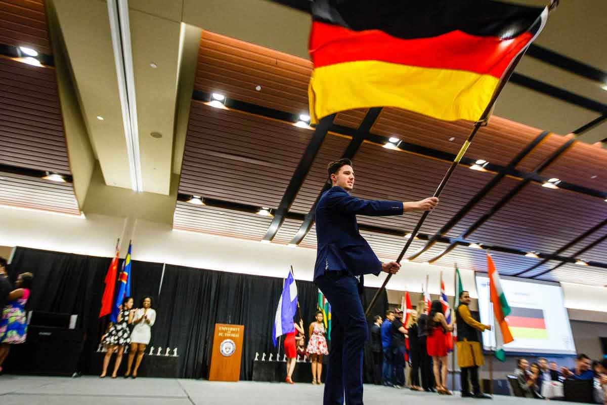 International student waving a German flag 