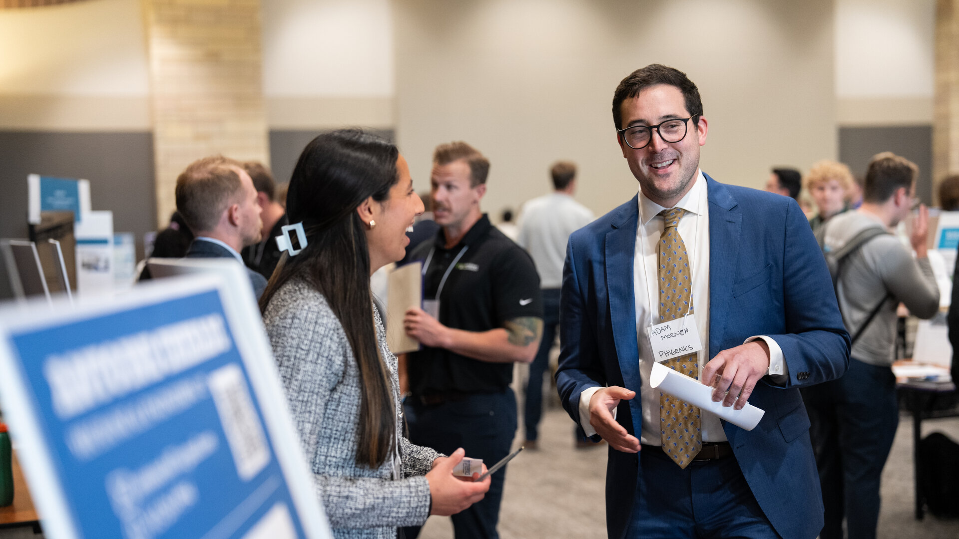 Student exchanges information with a potential employer