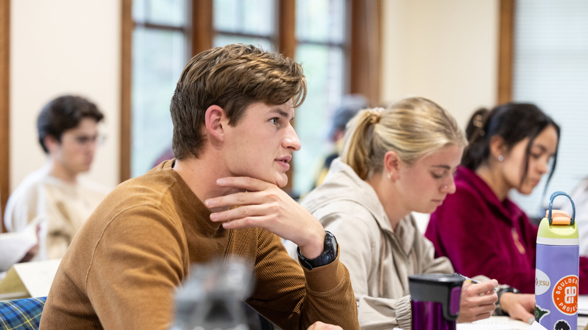 Undergraduate engineering students participate in a classroom discussion.