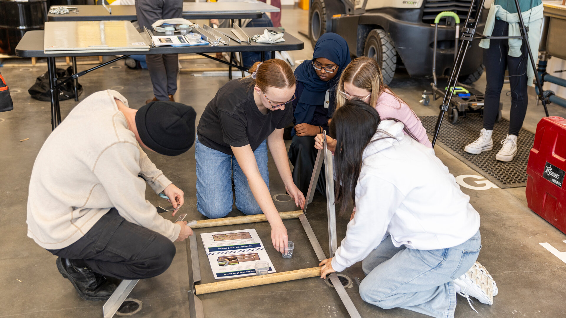 Engineering students compete in a bridge building competition