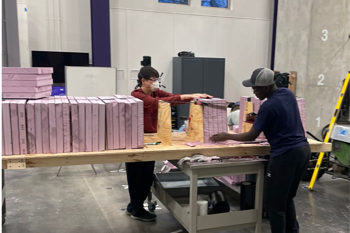 Civil engineering students work on concrete canoe project.