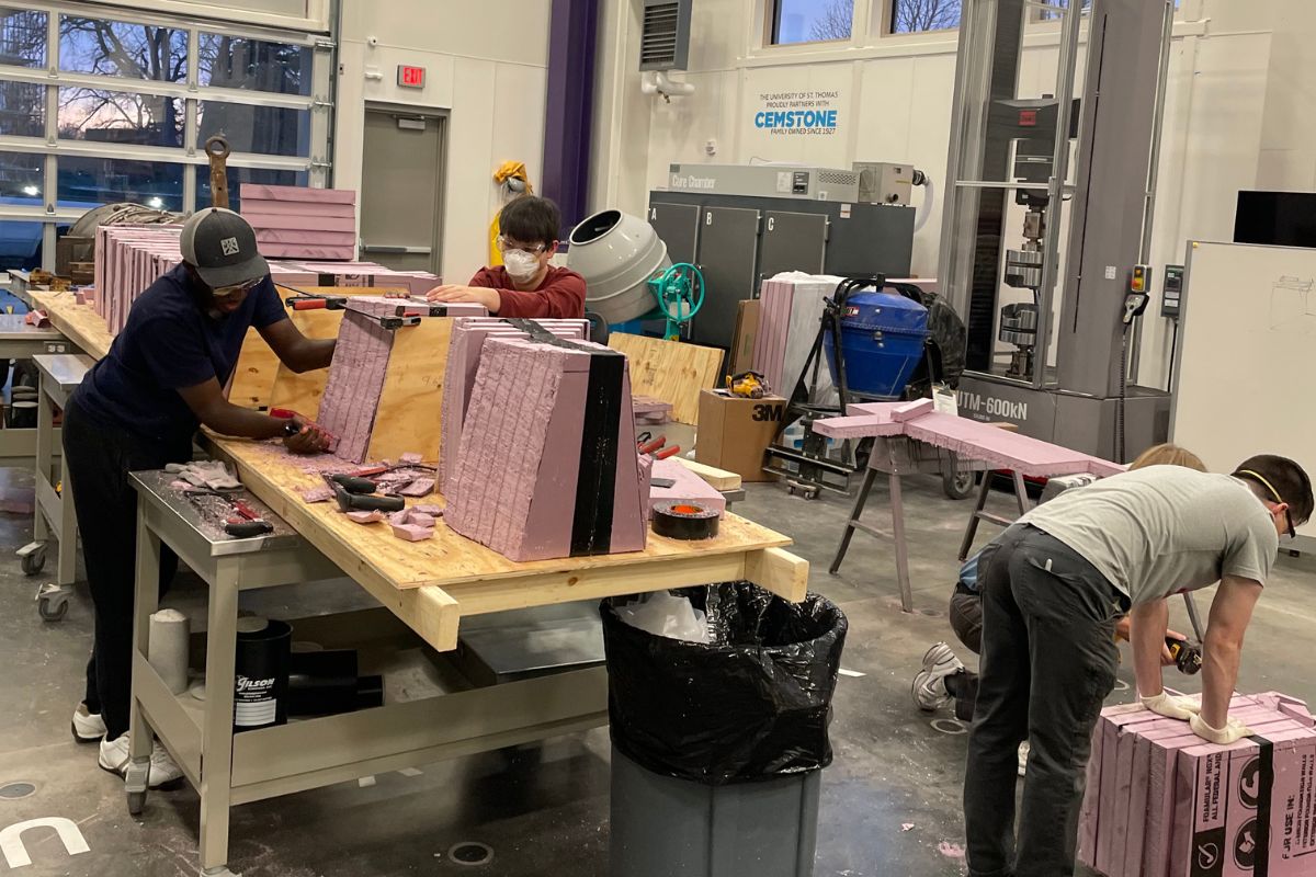 Civil engineering students work on concrete canoe project.