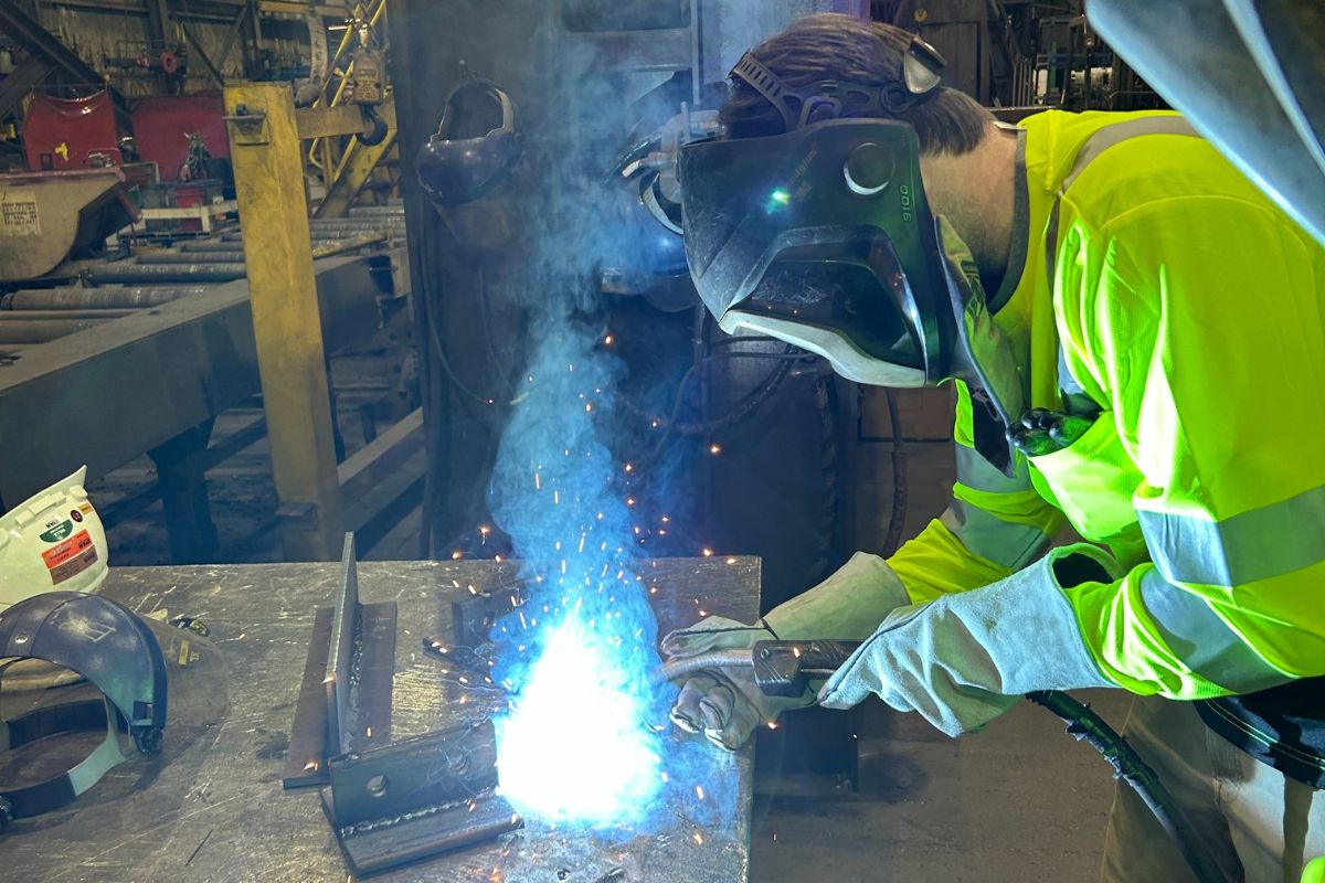 Engineering club member welds