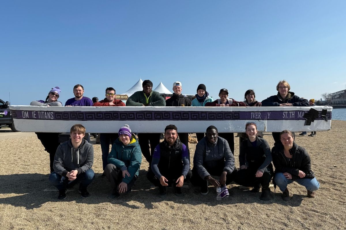 Group of St. Thomas civil engineering Concrete Canoe teammates pose.