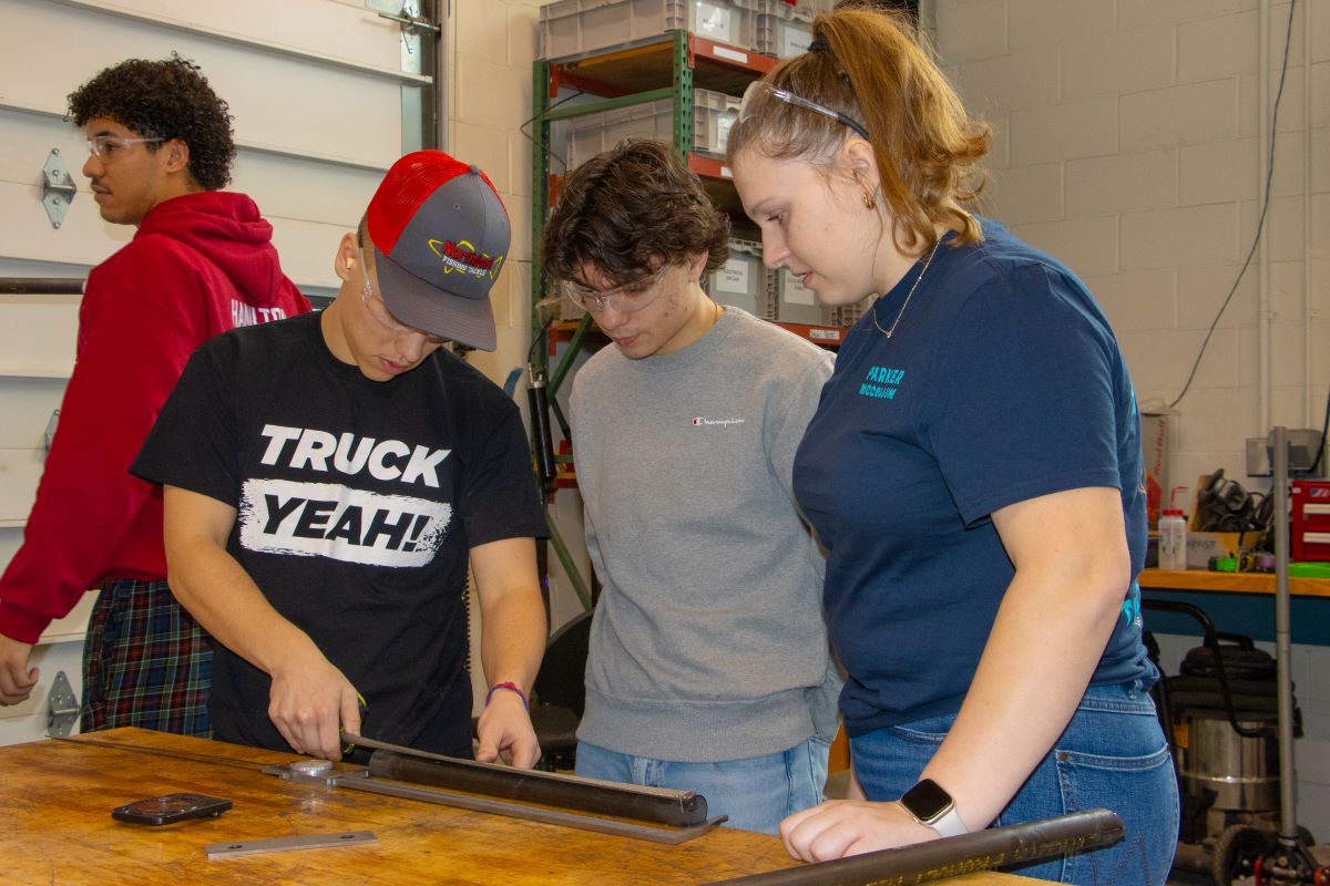 Tommie Motorsports club member interacts with vehicle.